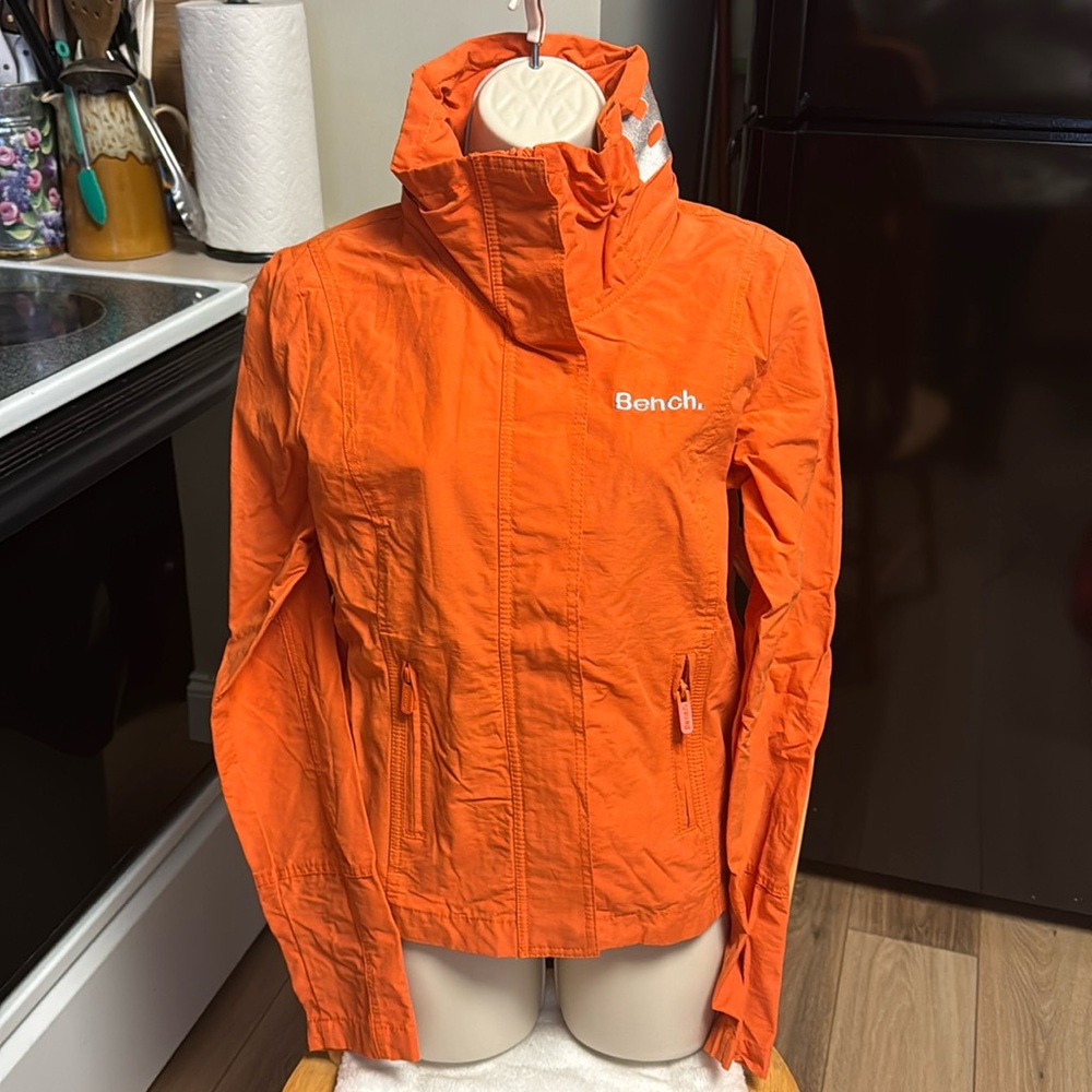 Bench NWT M (S) orange weather zipper pockets hidden hood rain jacket